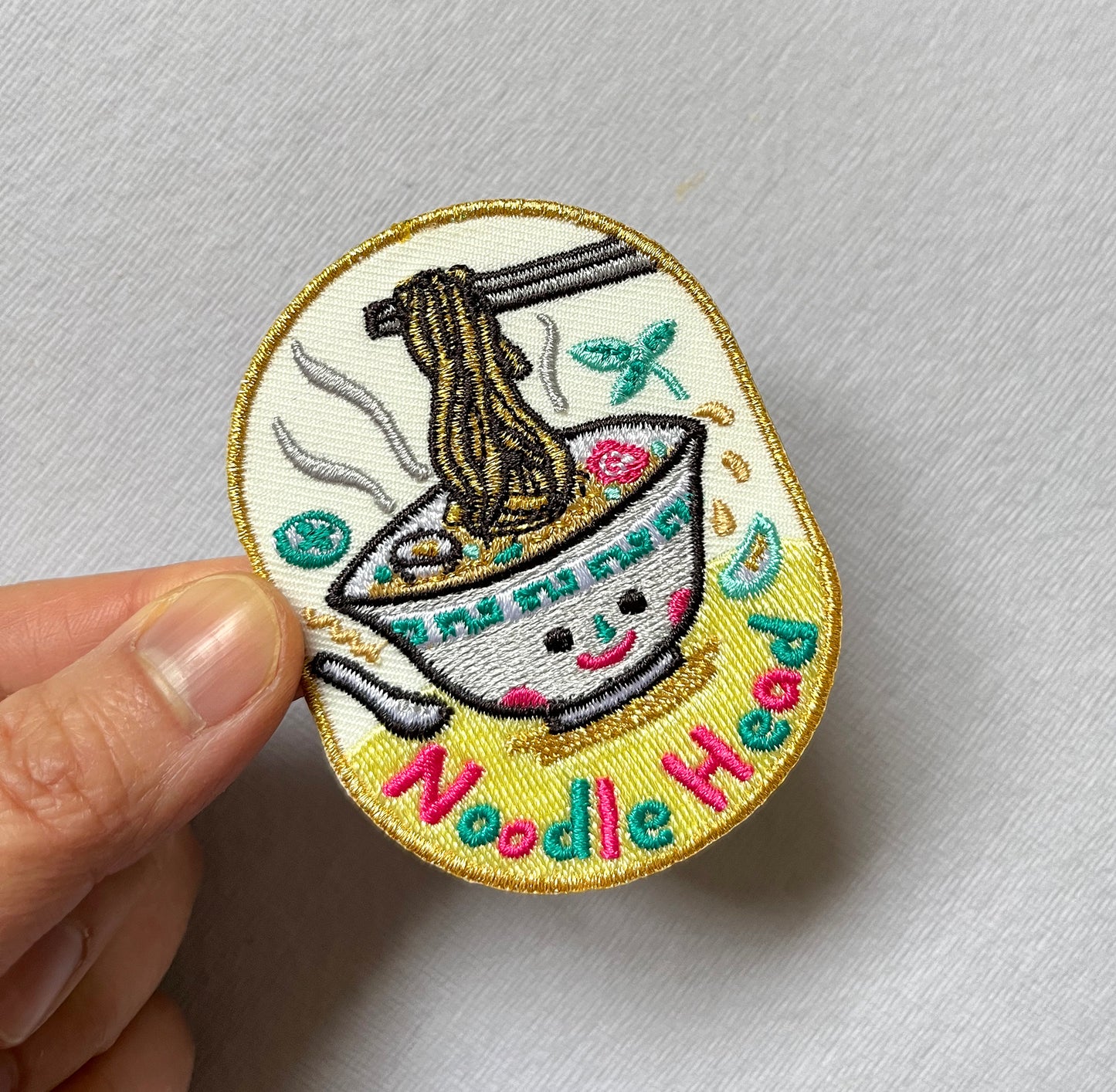 Noodle Head Iron On Patch - Gold edition